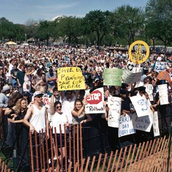 A crowd of demonstrators holding signs